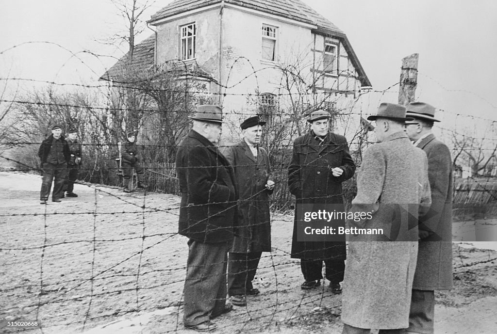View of Political Officials Talking at Iron Curtain
