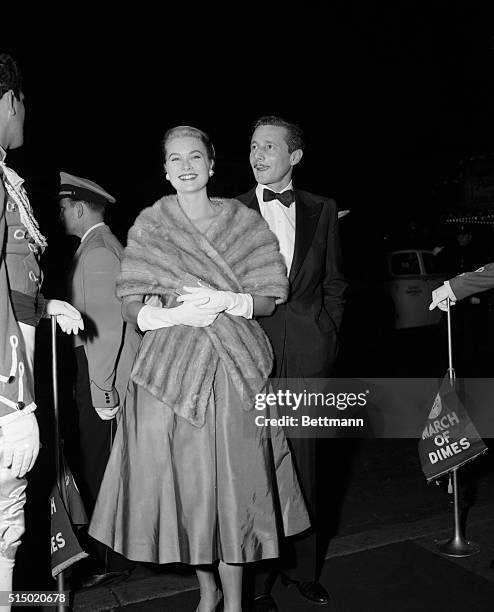 Movie actress Grace Kelly and her then steady escort, dress designer Oleg Cassini, are pictured at the gala premiere of the Napoleonic movie Desiree,...