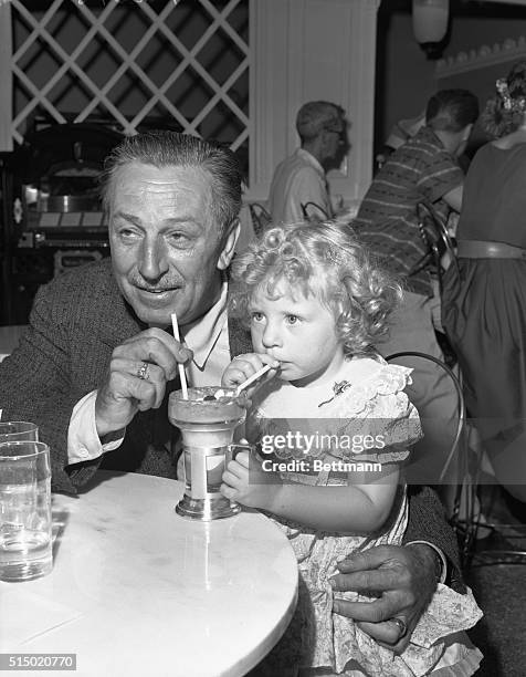 First visitor to Disneyland in Anaheim, California, sneaked in one day early and got some special treatment from the big bossman. She's Elaine Long...