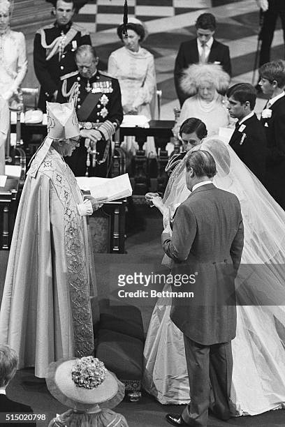 Photo shows Prince Charles, Diana Spencer and her father, Earl Spencer, in front of the priest during the wedding ceremony of Charles and Diana, held...