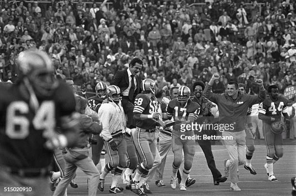 San Francisco 49ers Coach Dick Nolan is hoisted on the shoulders of his jubilant players after 49ers won the Western Division of the NFL by beating...