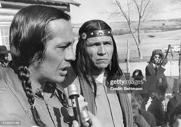 Two leaders of the American Indian Movement Russell Means and Dennis Banks appear grim after meeting with all the Indians at Wounded Knee, South...