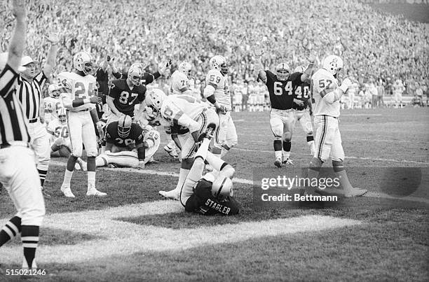 Oakland Raider quarterback Ken Stradier crashed into the end zone for a touchdown in the last seconds to score the winning TD against the New England...
