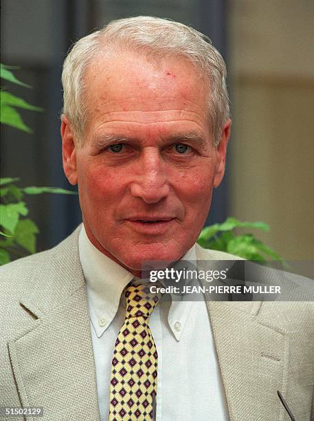 Actor Paul Newman poses for photographers in the streets of Paris, 23 August 1989. The Newman couple were in Paris for the shooting of James Ivory's...