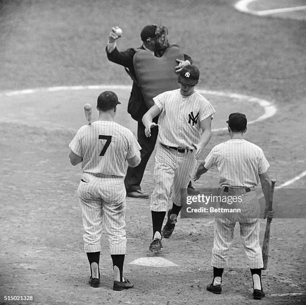 Roger Maris of the Yankees watches as his 56th home run sails into the right - center field bleachers in the seventh inning of the September 9th game...