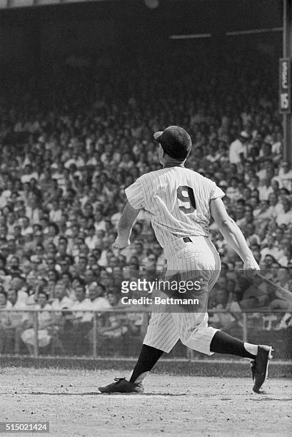 New York Yankees' Roger Maris watches his 52nd home run drop into the stands in sixth inning of game against Tigers, September 2nd. He later...