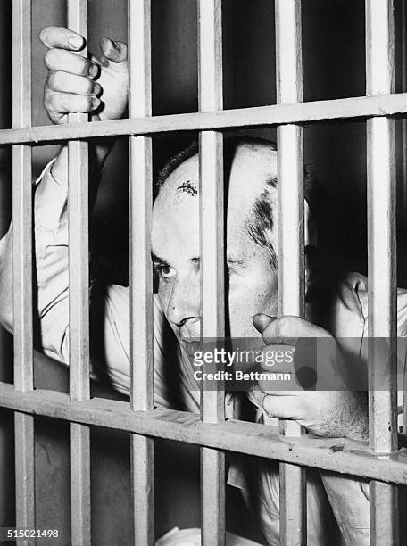 Richard Carpenter, who was arrested for the murder of two police officers, looks out from his cell. During his arrest attempt, Carpenter fled and...