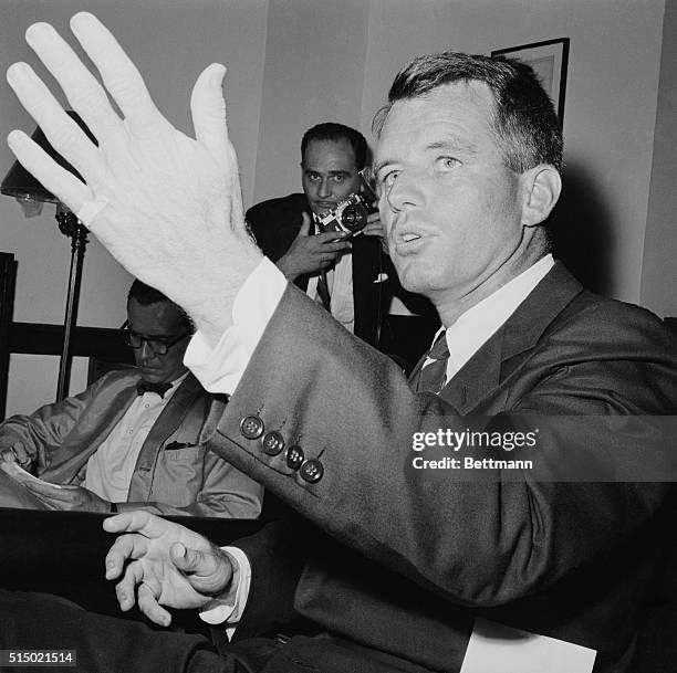 During press conference here, Attorney General Robert F. Kennedy, tells the newsmen that he blames materialism of the American people for the...