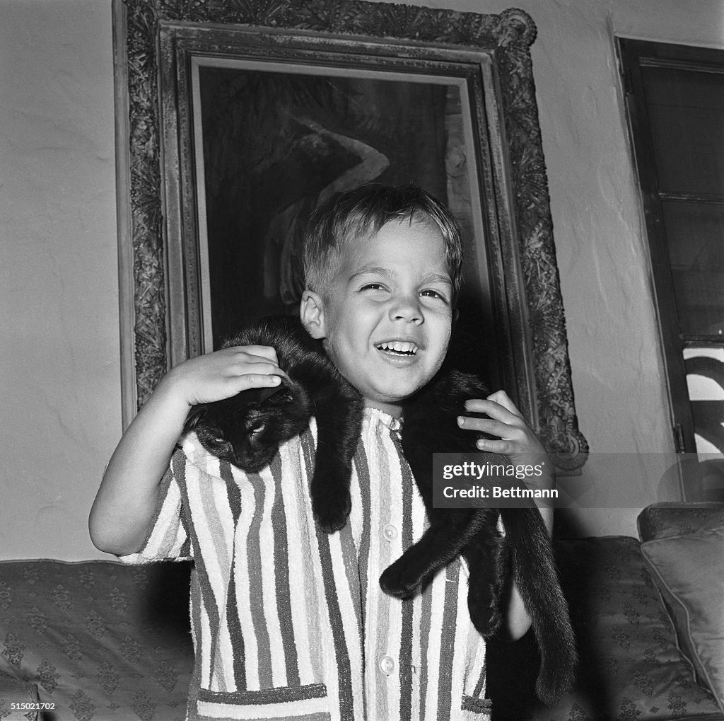 Christian Brando Playing with a Cat