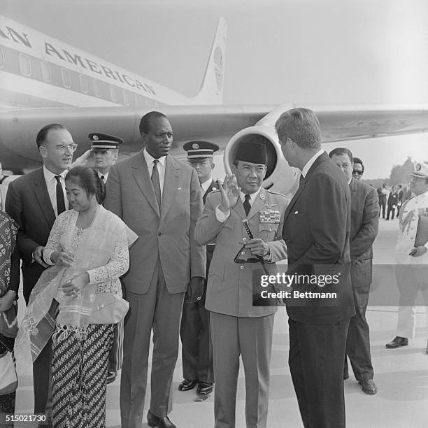 Indonesian President Sukarno gives the "OK" sign to President John Kennedy. At left is Mali's President Mobido. The two emissaries from the Belgrade...