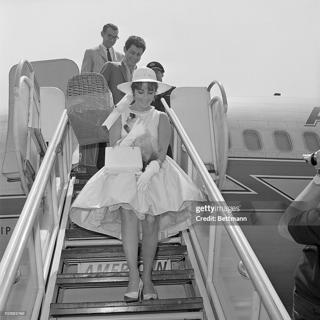 Elizabeth Taylor and Eddie Fisher Leaving Airplane