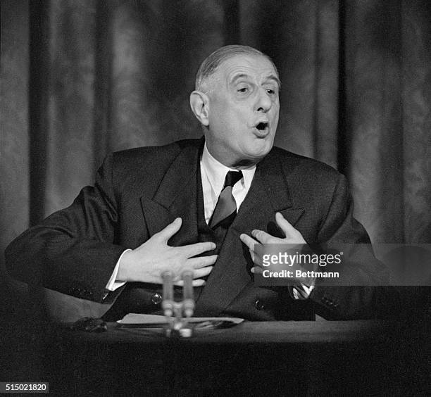 French President Charles De Gaulle talks to newsmen here during a press conference at Elysee Palace. De Gaulle said the Western allies must hold...