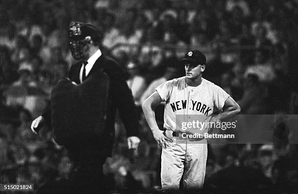 Roger Maris glowers as umpire Bill McKinley halts the Yankee-White Sox game 9/13 because of rain while Maris was at bat in 3rd inning. Maris, who...