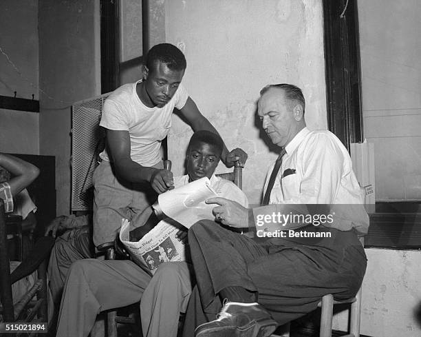 New Witnesses Questioned by D.A. In "Wolf-Whistle" Trial. Sumner, Mississippi: District Attorney Gerald Chatham, right, talks to two new witnesses...