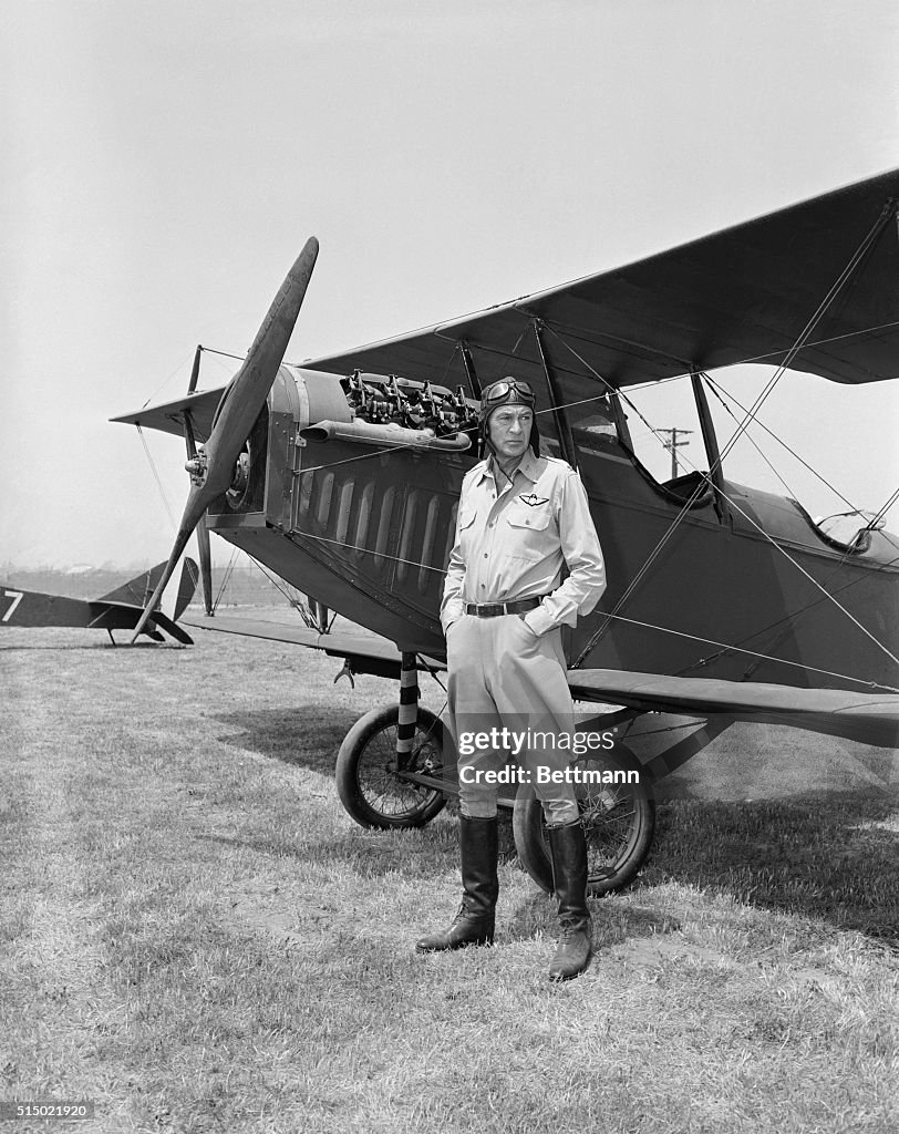 Gary Cooper Posing in Front of Plane