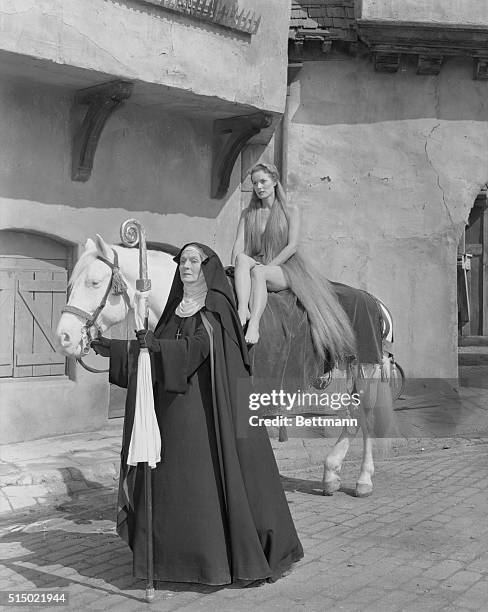 Godiva Rides Again. Hollywood, Los Angeles, California: Red haired Maureen O'Hara, astride a white mount, portrays the title role of Lady Godiva,...