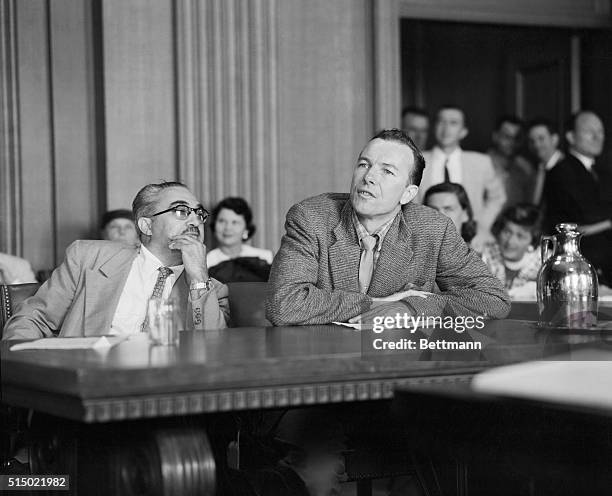 Pete Seeger being sworn in with his attorney Paul Ross at left.