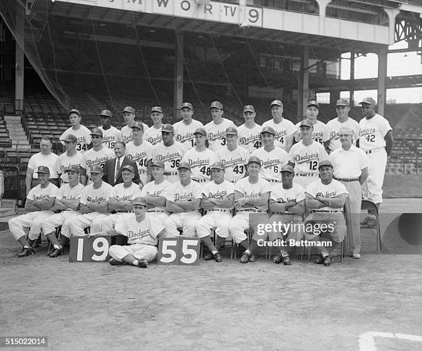 Flag Winning Dodgers Pose for Team Photo. Brooklyn, New York: With the National League pennant safely tucked away in mothballs, the Brooklyn Dodgers...