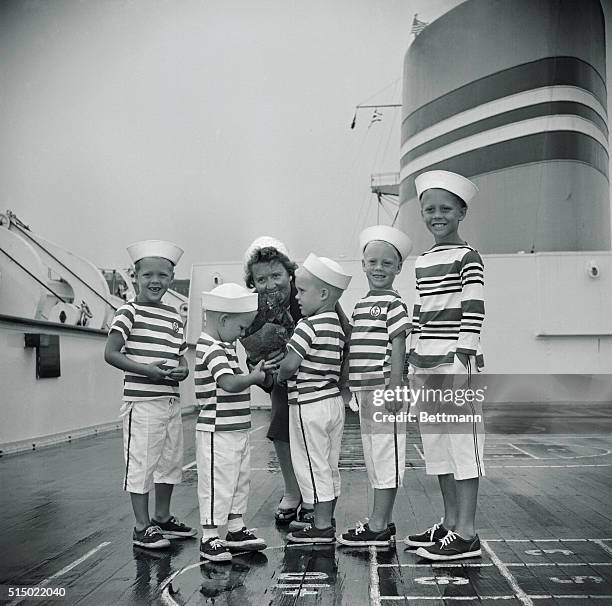 Mrs.Ingeberg Dalland of Barnegat Light, N.J. Is greeted upon return from Bergen, Norway by her five grandsons aboard liner Oslofjord here August...