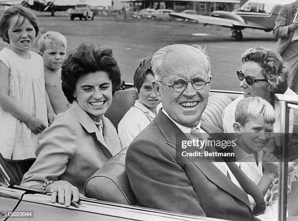 Father of U.S. President John Kennedy and former U.S. Ambassador Joseph P. Kennedy smiles as he sits in a car with : Courtney; David; Ann Gargin;...