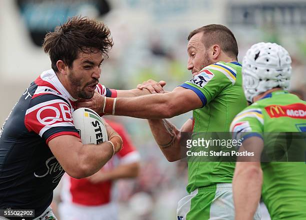 Aiden Guerra of the Roosters is tackled during the round two NRL match between the Canberra Raiders and the Sydney Roosters at GIO Stadium on March...