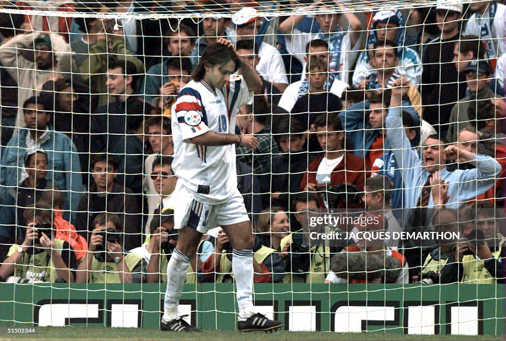 French midfielder Reynald Pedros scratches his hea