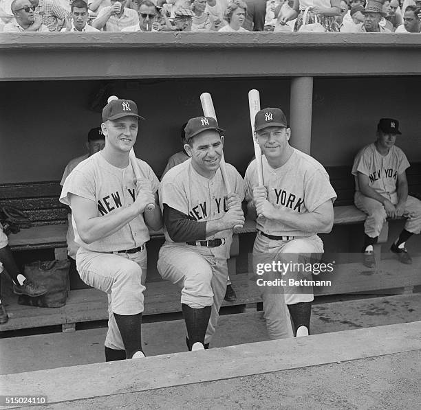 New York Yankee power hitters : Roger Maris, Yogi Berra and Mickey Mantle pose for photographers before their team beat the Red Sox 11-9 at Fenway...