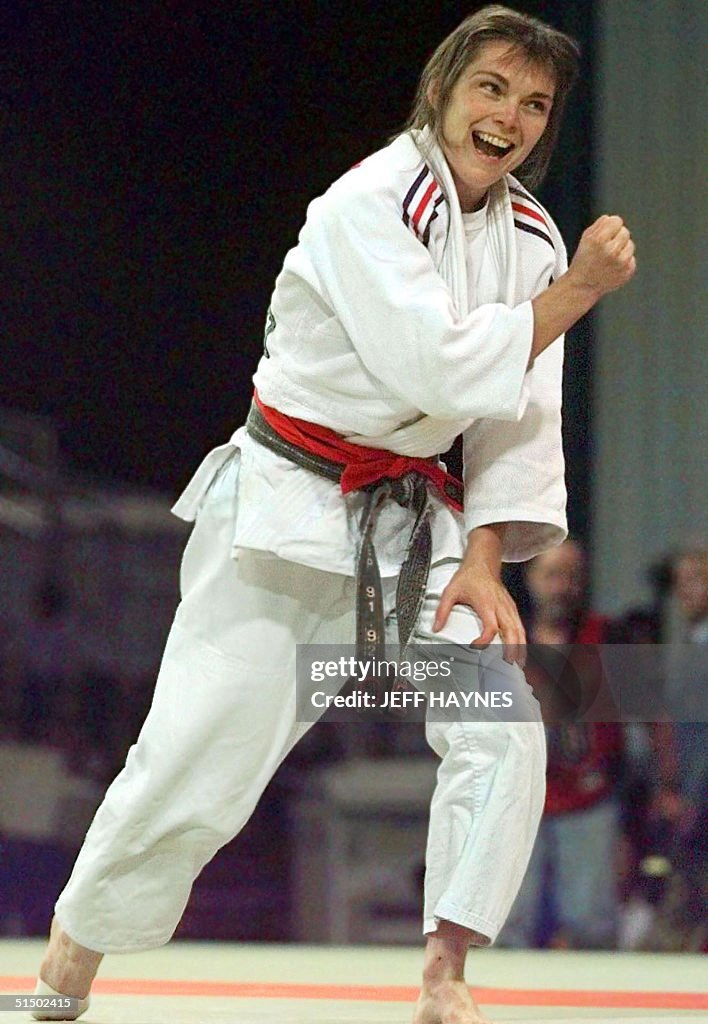 Restoux Marie Claire Restoux of France pumps her fist in victory after... News ...