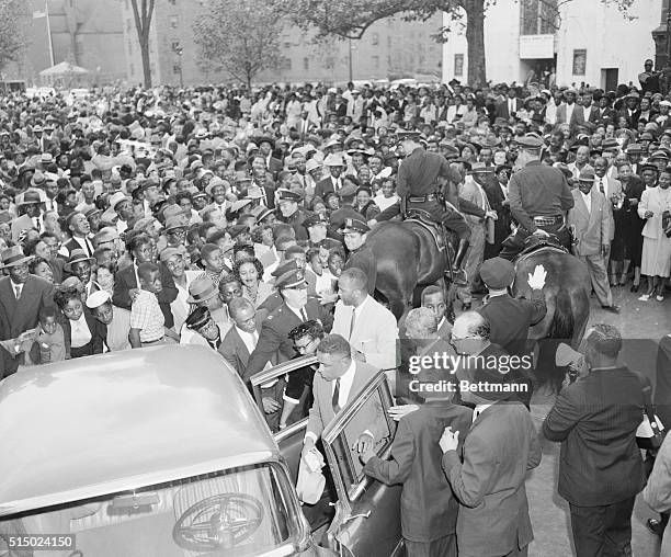 New York: A huge crowd gathers around Mrs. Mamie Bradley outside the Williams Institutional C.M.E. Church in Harlem today where a meeting was held to...