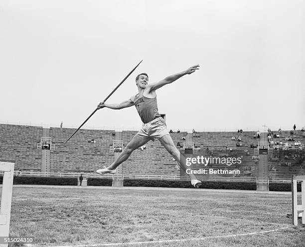 Javelin thrower Bill Alley of Syracuse University begins his throw during the IC4A Track and Field Championship. Alley's throw went for a distance of...