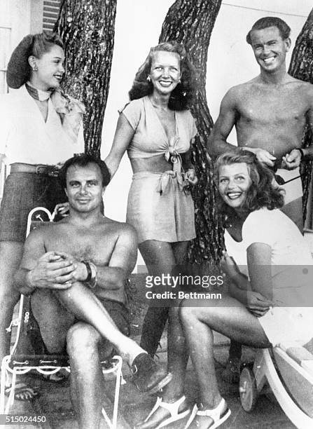 Ann Woodward in 1948 at Chateau L'Horizon, property of Prince Aly Khan, bottom left, who would wed Rita Hayworth the next year. Top left is Bonnie...