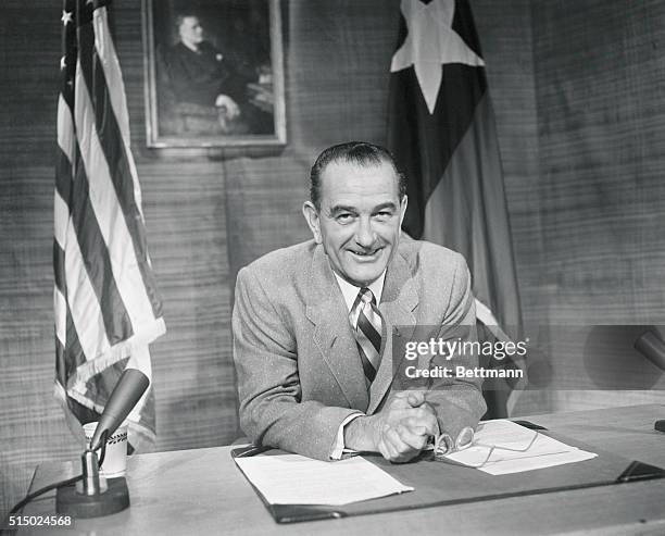 Senate Democratic leader Lyndon Johnson is shown as he addressed a TV-radio audience last night. Behind him are the flags of the U.S. And of Texas....