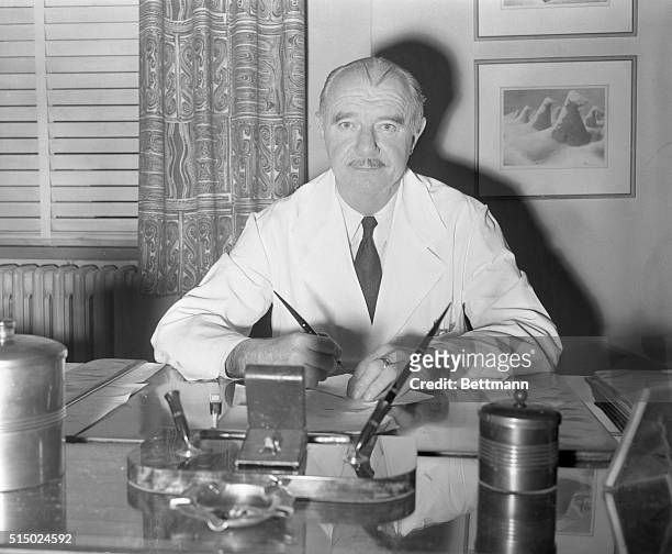 Winner of Nobel Prize for Chemistry. New York, New York: Professor Vincent du Vigneaud, who won the Nobel Prize in Chemistry, is shown at his desk at...