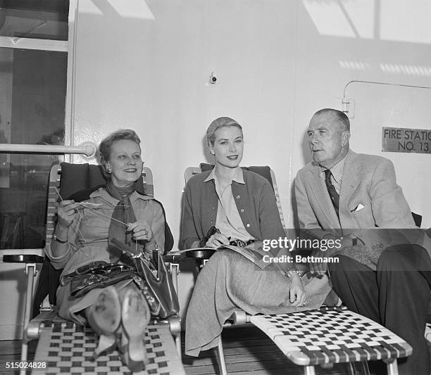 Millionaire contractor John B. Kelly of Philadelphia poses with his wife Margaret, and their daughter actress Grace Kelly aboard the liner...