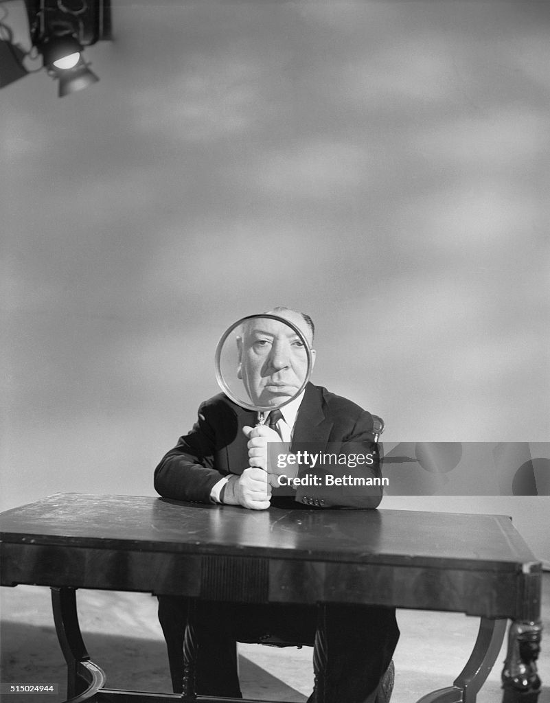 Alfred Hitchcock Holding Magnifying Glass