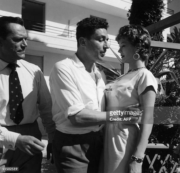 An undated picture shows American film director John Berry with Eddie Constantine and Monique Van Vooren. Denounced by Dmytryk as Communist Berry was...