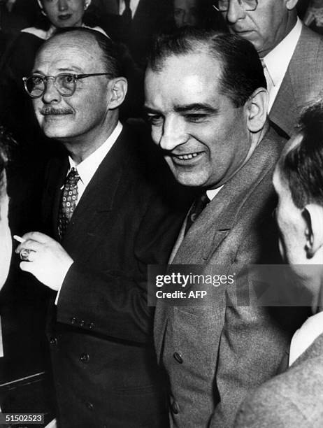 Owen Lattimore passes Senator Joseph McCarthy after ex-Communist Louis F. Budenzho called him a member of a Communist spy cell in testimony before...