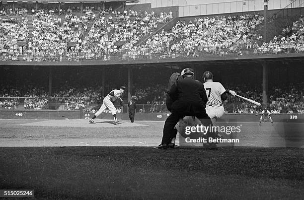 These cross fire views from center field and from behind home plate, at Tiger Stadium shows Tigers' Jim Bunning pitching to Yankees' Mickey Mantle in...