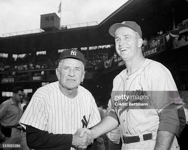 The "Brain Departments" of the American and National League Teams meet and shake hands and wish each other luck just before the start of the 23rd...