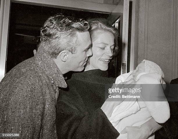 Actress Lauren Bacall and her husband actor Jason Robards Jr., prepare to take her infant son Sam home from the Columbia-Presbyterian Medical center...
