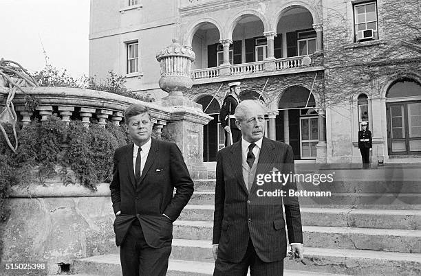 President John F. Kennedy, and British Prime Minister Harold Macmillan leave the Government House here, after the two Western leaders lunched...