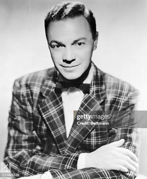 Waist-up portrait of legendary disc jockey Alan Freed. Freed was the first person to utter the phrase "rock and roll" for the new musical sounds...