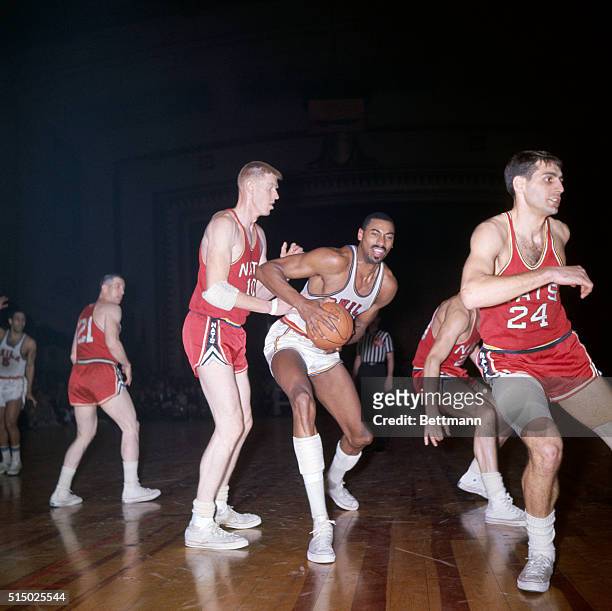 Philadelphia, PA: Wilt Chamberlain , steals the ball from the hands of Larry Costello of the Nationals as Costello during a game between the Syracuse...