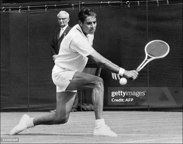 American tennis player Ricardo "Pancho" Gonzales as he was about to hit a ball at Wimbledon, in June 1971. Gonzales won twice the men's singles title...