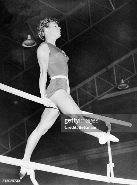 LARISA LATYNINA, U.S.S.R GYMNASTICS GOLD MEDAL WINNER DURING COMPETITION. 12/5/56