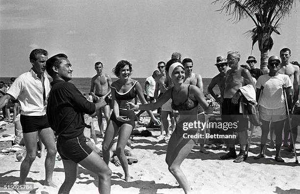 Susie Moritz and Laura Hale dance the twist on a Fort Lauderdale beach. Both are students at Broward Business College in town and they are eager to...