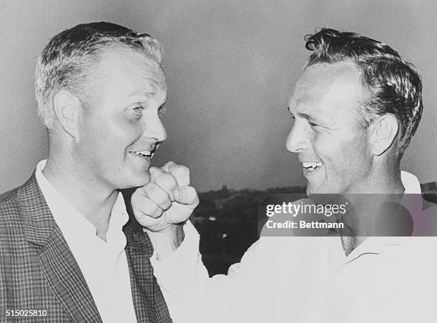 Oakmont, Pa.: Arnold Palmer playfully punches the chin of Jack Nicklaus after Nicklaus won the U.S. Open at the Oakmont Country Club in an extra day...