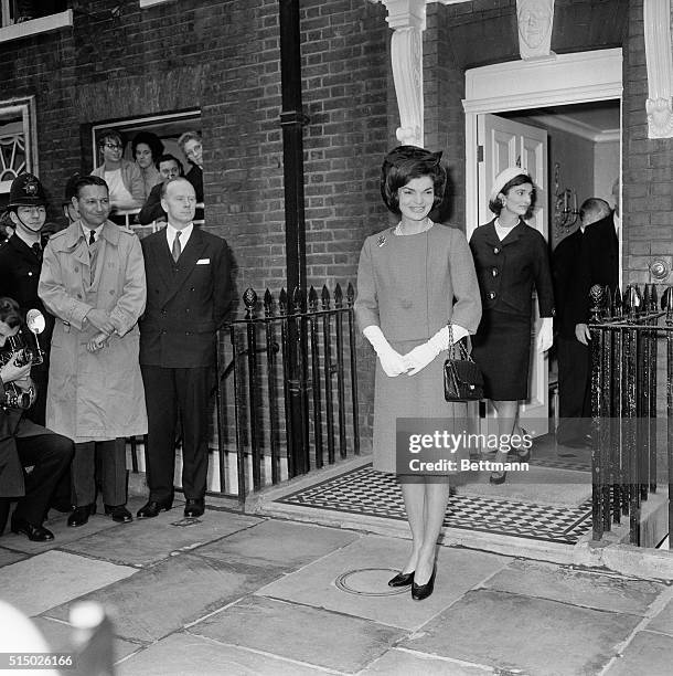 Mrs. Jacqueline Kennedy, wife of the American President, now on the third day of her private visit to London, leave No. 4 Buckingham Place, home of...