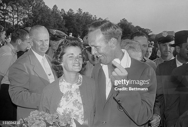 Champion Palmer and Golf Ball. Augusta, Ga.: Arnold Palmer, elated over his third Masters tournament victory, shows the ball he played to his wife,...