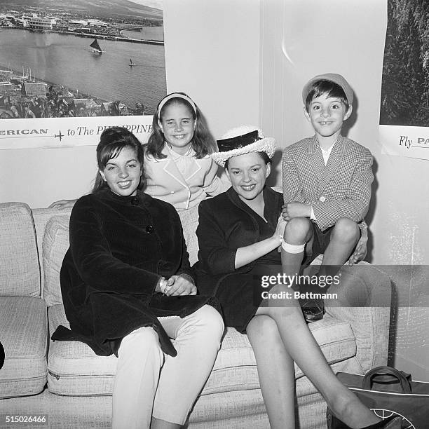 Singer Judy Garland waits with children Liza Minnelli, age 16, the daughter of a previous marriage, Lorna Luft, age 9, and Joey Luft, age 7, children...